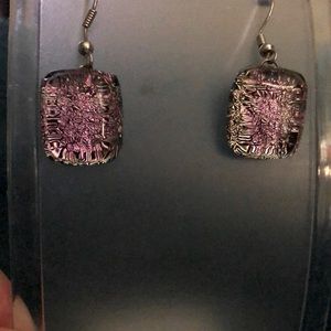 Pink and different colors glimmer inside these earrings.